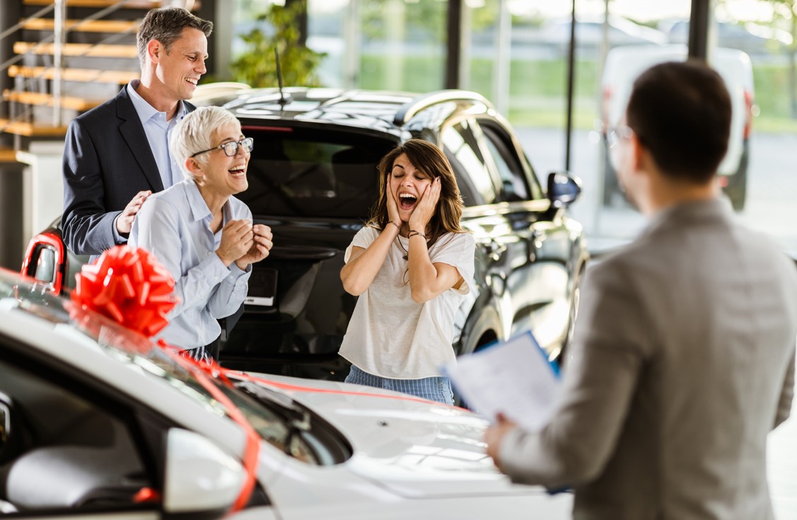 People buying a car at a dealership